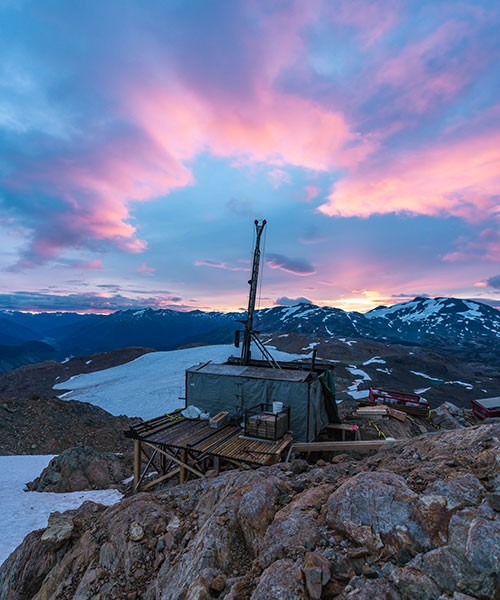 A diamond drill rig assembled by helicopter sits on a wooden drill pad at an elevation of 6,000 feet in northwestern British Columbia.